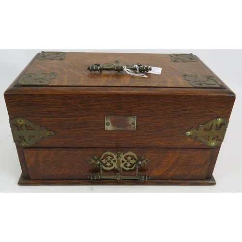 57 - An Edwardian oak smokers cabinet with plated mounts, two similar cigar/cigarette boxes and an antiqu... 