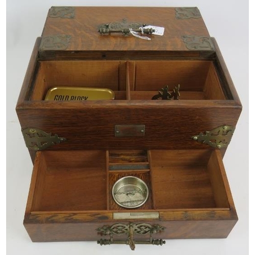 57 - An Edwardian oak smokers cabinet with plated mounts, two similar cigar/cigarette boxes and an antiqu... 