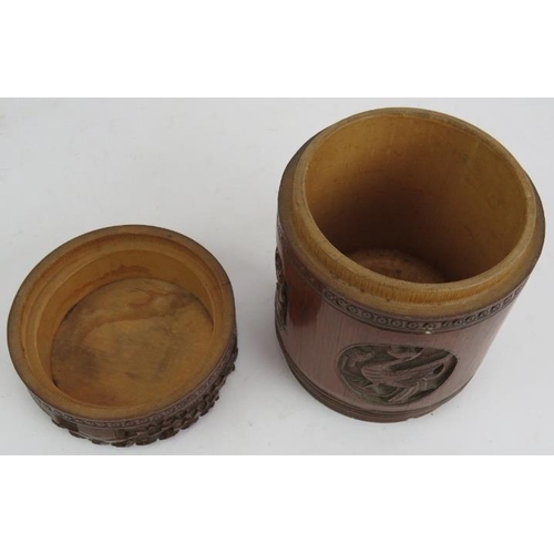 6 - A Chinese carved bamboo caddy jar and cover. Height 16cm. Diameter 12cm. 
Condition report: No issue... 