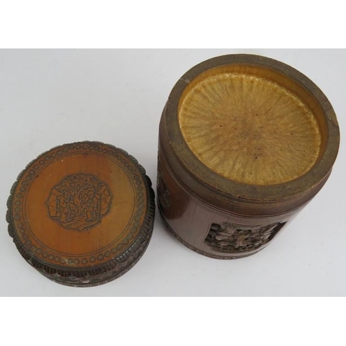 6 - A Chinese carved bamboo caddy jar and cover. Height 16cm. Diameter 12cm. 
Condition report: No issue... 