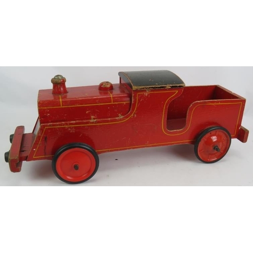 63 - A vintage wooden Triang Loco toy train, Length: 63cm.
Condition report: Front wheels are later.