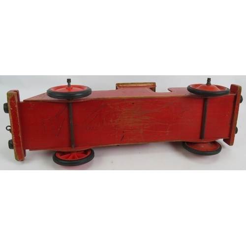 63 - A vintage wooden Triang Loco toy train, Length: 63cm.
Condition report: Front wheels are later.