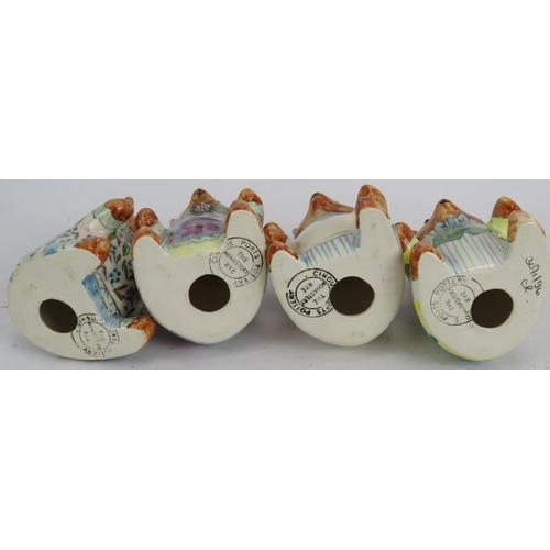 68 - Four Cinque Ports pottery hand decorated bears, two Rye pottery figurines and two colourful Party Pi... 