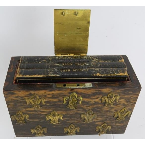 7 - A Victorian coromandel desk top book safe decorated with gilt brass fleur-de-lys and with engraved g... 