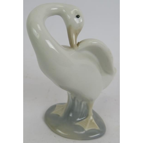 70 - A Lladro Spanish porcelain figure of a dentist, a small Lladro goose and a pair of Bavarian Gerold p... 