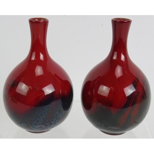 75 - A pair of Royal Doulton red flambé veined vases, No 1606, 11.5cm tall.
Condition report: Both have l... 