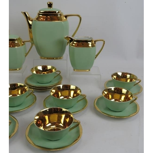 76 - A 21 piece Gilt and Green Limoges R.G. Montigny tea set, comprising: tea pot, milk jug, sugar bowl, ... 