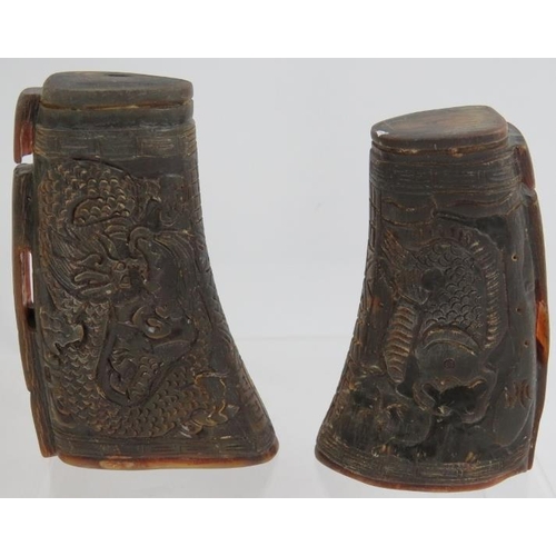 78 - A pair of Chinese carved buffalo horn libation cups one with dragon designs and one with koi carp. T... 