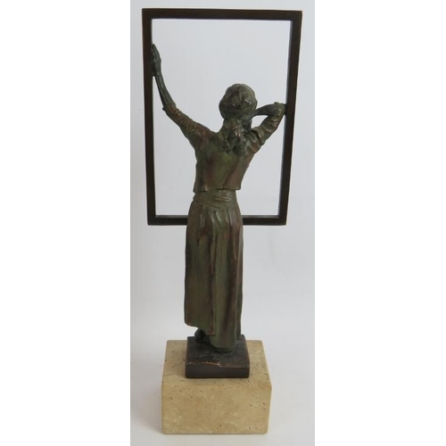 79 - A contemporary bronzed sculpture of a woman at a window mounted on a stone plinth. Signed Miro, 1996... 