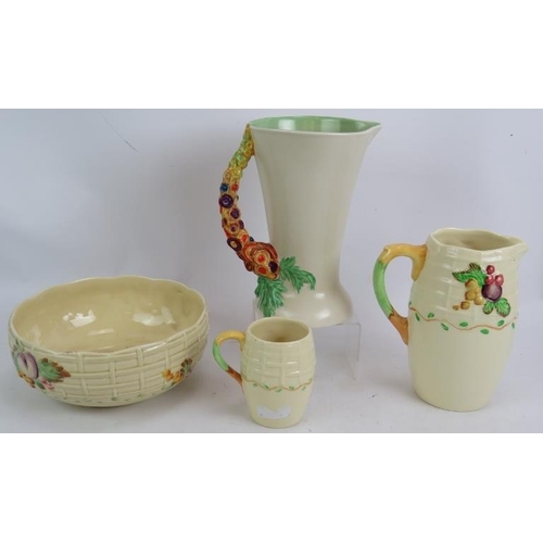 81 - A Clarice Cliff 672 My Garden jug, an 883 pattern fruit bowl and two A J Wilkinson fruit and trellis... 