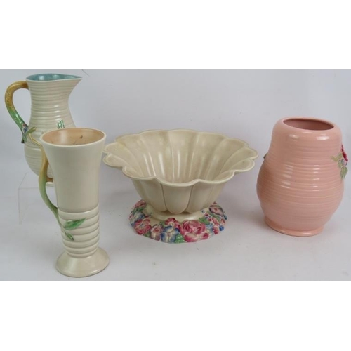 82 - Four pieces of Clarice Cliff hand decorated relief moulded pottery including a large fluted bowl. 30... 