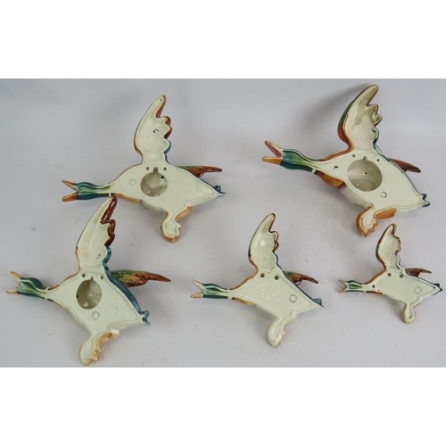 9 - A vintage set of five Beswick pottery flying duck wall plaques. Largest 29cm high. (5).
Condition re... 