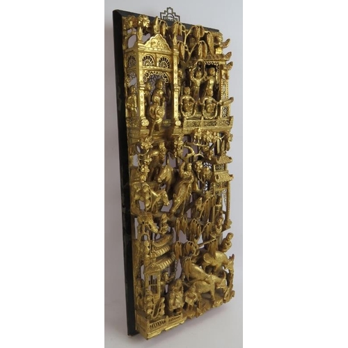 96 - A fine quality intricately carved Chinese Chaozhou giltwood carved panel of exquisite detail, from t... 