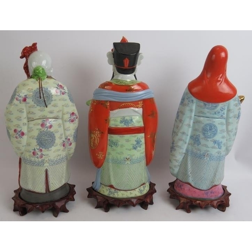 97 - A set of 3 finely decorated 20th century Chinese porcelain figures representing health, wealth and w... 