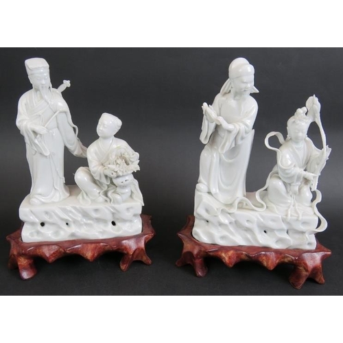 98 - A 20th century Chinese porcelain Blanc de Chine figure of Guan Yin on carved wooden stand and four o... 