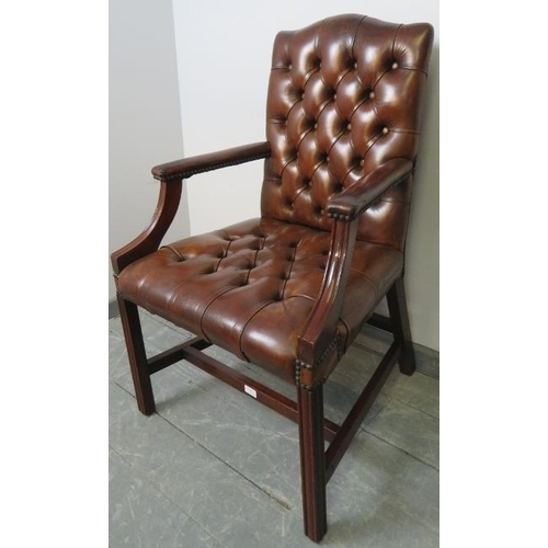 701 - A vintage 'Gainsborough' open-sided armchair, upholstered in tobacco brown buttoned leather with bra... 