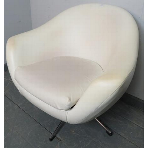 709 - A mid-century ‘Pod’ swivel chair in the manner of Overman, upholstered in white vinyl, on a chrome b... 