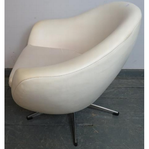 709 - A mid-century ‘Pod’ swivel chair in the manner of Overman, upholstered in white vinyl, on a chrome b... 