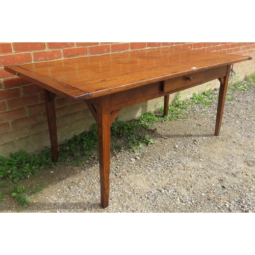 711 - A 19th century French oak country kitchen dining table with single drawer to side, on braced taperin... 