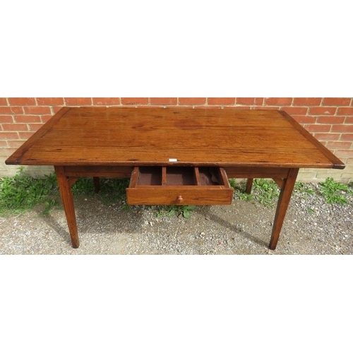 711 - A 19th century French oak country kitchen dining table with single drawer to side, on braced taperin... 