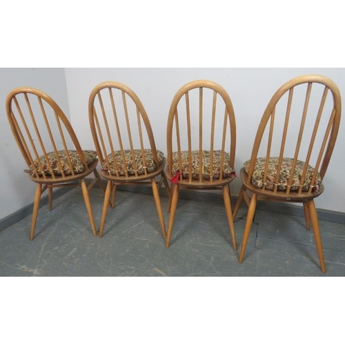 713 - A set of four mid-century elm and beech Windsor Quaker dining chairs by Ercol, on canted supports wi... 