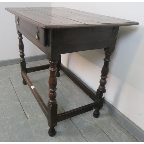 715 - A late 17th century oak side table in unrestored condition, with single drawer featuring original br... 