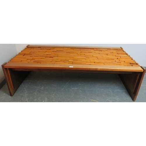 718 - A mid-century hardwood Brutalist coffee table by Percival Lafer (Brazilian, b. 1936) with loose glas... 