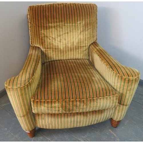 725 - A large bespoke scroll-back armchair by Duresta, upholstered in gold and green striped crushed velve... 