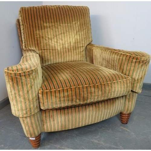 725 - A large bespoke scroll-back armchair by Duresta, upholstered in gold and green striped crushed velve... 