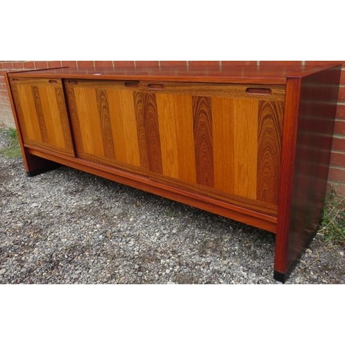 727 - A mid-century tropical hardwood Danish sideboard featuring inlaid specimen woods, the three sliding ... 