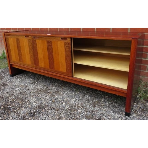 727 - A mid-century tropical hardwood Danish sideboard featuring inlaid specimen woods, the three sliding ... 