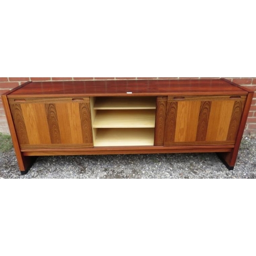 727 - A mid-century tropical hardwood Danish sideboard featuring inlaid specimen woods, the three sliding ... 