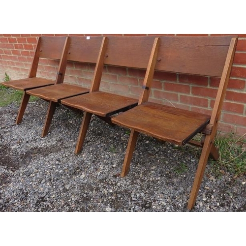 729 - An antique oak four-seat chapel bench, with folding seats, on folding supports. 
Condition report: M... 