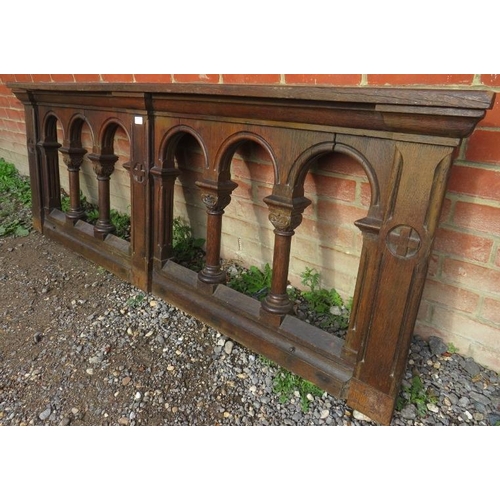 732 - A 19th century oak altar rail featuring relief carving and arches with Corinthian column dividers. 
... 