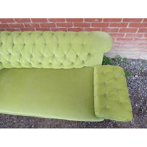 734 - An Edwardian chesterfield two-seater drop-end sofa, upholstered in a gold buttoned material, on ogee... 