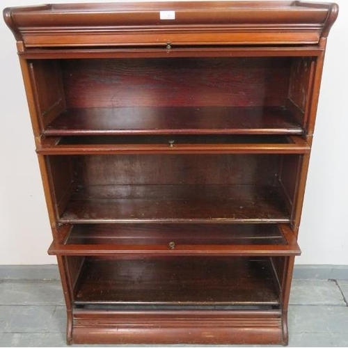 740 - A vintage mahogany Globe-Wernicke style glazed stacking bookcase, of three sections, on a plinth bas... 