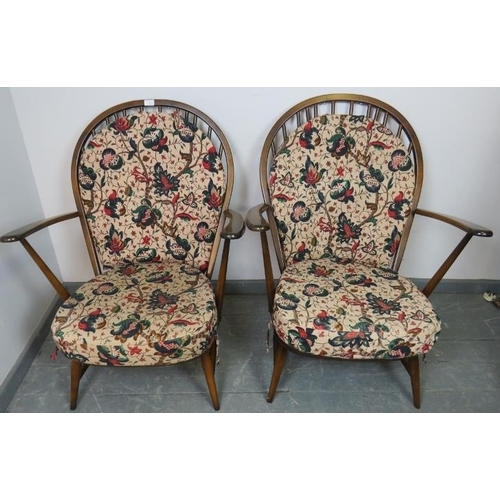 743 - A pair of vintage elm ‘Grandfather’ Windsor armchairs by Ercol (model 317) with loose seat cushions ... 