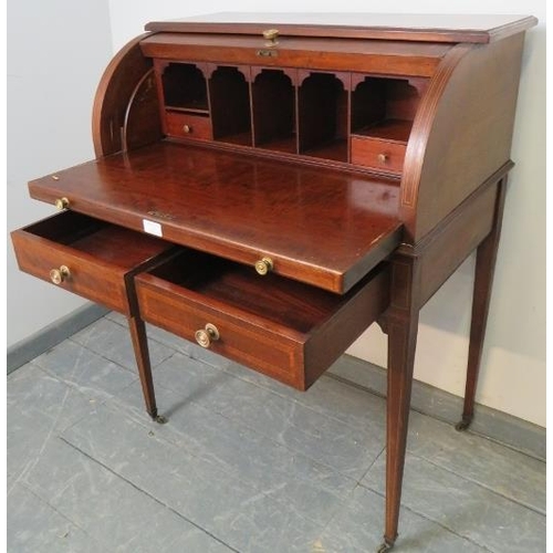 745 - An Edwardian mahogany Regency Revival cylinder top writing desk, featuring crossbanded inlay and str... 