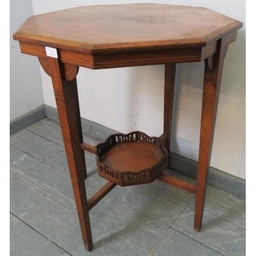 752 - An Edwardian walnut octagonal occasional table, inlaid and strung with satinwood, on tapering square... 