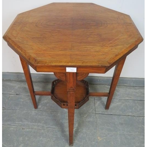 752 - An Edwardian walnut octagonal occasional table, inlaid and strung with satinwood, on tapering square... 