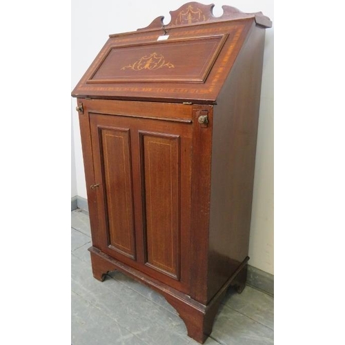 761 - A small Edwardian mahogany marquetry inlaid bureau, with fitted interior and cupboard under with two... 