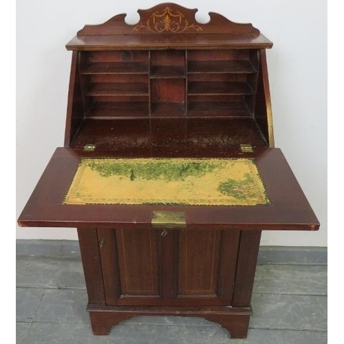 761 - A small Edwardian mahogany marquetry inlaid bureau, with fitted interior and cupboard under with two... 