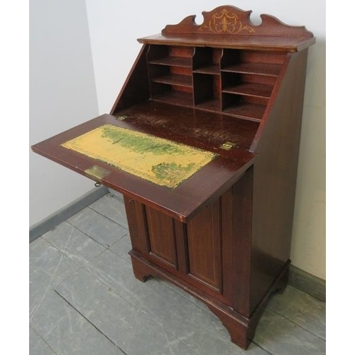 761 - A small Edwardian mahogany marquetry inlaid bureau, with fitted interior and cupboard under with two... 