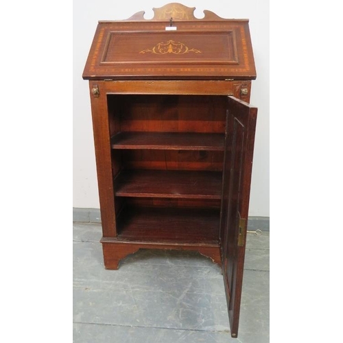 761 - A small Edwardian mahogany marquetry inlaid bureau, with fitted interior and cupboard under with two... 