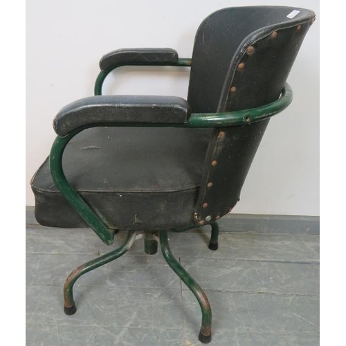 765 - A vintage machinist’s swivel armchair by Cox & co, upholstered in green Rexine, on steel supports. 
... 