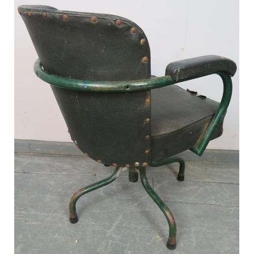 765 - A vintage machinist’s swivel armchair by Cox & co, upholstered in green Rexine, on steel supports. 
... 