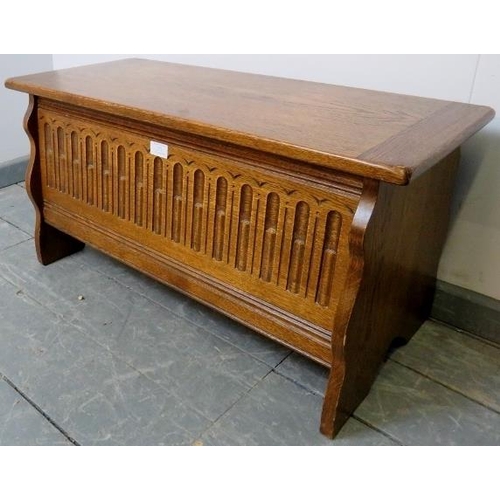 771 - A vintage medium oak coffer/blanket box in a 17th century taste, featuring carved arcaded front, on ... 