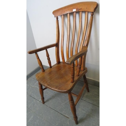 772 - A 19th century country made elm and beech Windsor armchair, on turned supports with an ‘H’ stretcher... 