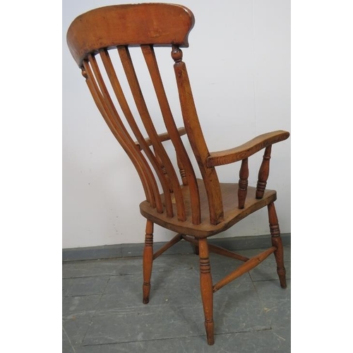 772 - A 19th century country made elm and beech Windsor armchair, on turned supports with an ‘H’ stretcher... 