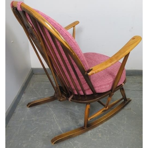 781 - A mid-century elm ‘grandfather’ Windsor rocking chair by Ercol (model 315) with loose cushions uphol... 